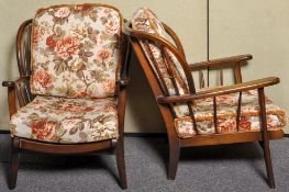 A pair of 1980's Ercol style retro vintage armchairs having spindle backrest,