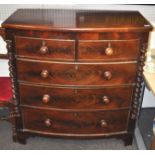 A mahogany two over three chest of drawers raised bracket leg.