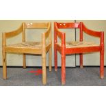 A pair of Vico Magistretti Carimate open armchairs having rush drop in seats .