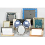 A collection of eight picture frames mostly all being silver plated in varying designs and sizes.