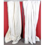 A pair of lined cream curtains