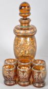 Argento Garantito 925/1000 amber glass decanter set with floral decorated silver overlay.