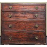 A George IV mahogany chest of drawers having a run of four graduating drawers,
