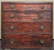 A George IV mahogany chest of drawers having a run of four graduating drawers,