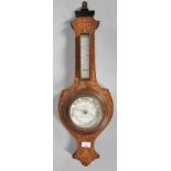An Edwardian mahogany and inlay small barometer.