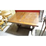 A 1940's oak draw leaf rectangular table raised on a splayed foot. Measures; 77cm x 106cm x 43cm.