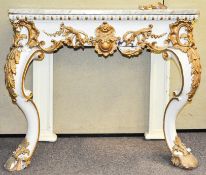 A marble topped console table having moulded gilt decoration,