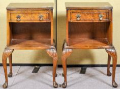 A pair of reproduction mahogany bedside tables on cabriole supports,