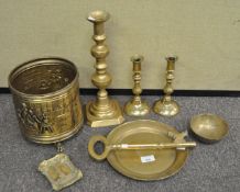 A collection of brass ware to include candlesticks, oversized key, bowl and more.