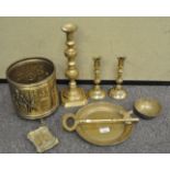 A collection of brass ware to include candlesticks, oversized key, bowl and more.