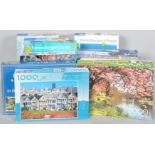 A collection of assorted boxed jigsaws