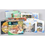 A collection of assorted boxed jigsaws