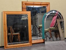 Three mirrors to include two wooden framed examples and a frameless example. Measures; 93cm x 68cm.