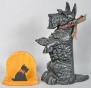 A cast metal Scottie dog and a wooden bookend