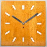 A 20th Century golden oak cased eight day wall clock with squared face.