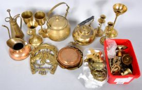 A group of assorted metalware to include a brass kettle and other items.