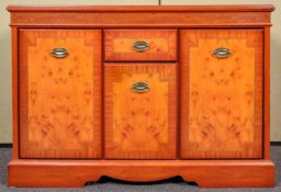 A reproduction yew wood sideboard