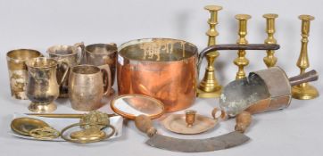 A collection of assorted metal ware to include a copper pan, brass candlesticks and other items.