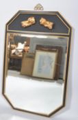 A contemporary ebonised and giltwood chinoiserie mirror, of octagonal section,