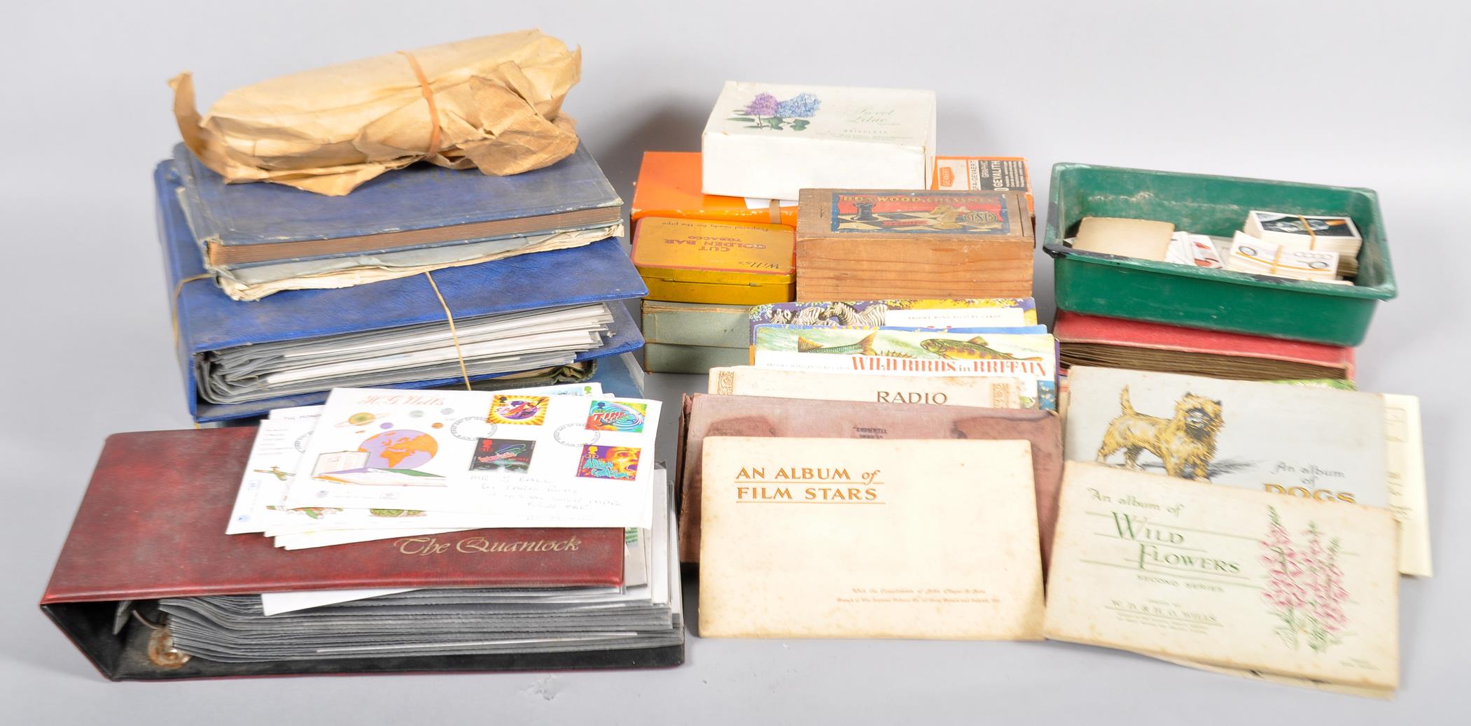 A large collection of stamps, first day covers, cigarette cards and Brooke Bond tea cards.