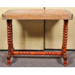 A Victorian centre table with copper top, raised on bobbin turned supports and splayed feet.