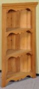 A pine wall hanging three shelf corner unit. Measures; 94cm high.