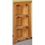 A pine wall hanging three shelf corner unit. Measures; 94cm high.