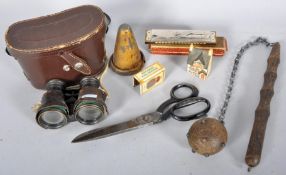 A pair of opera glasses, a M Hohner echo harmonica, a ball and truncheon and other items