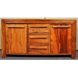 A contemporary African fruitwood sideboard credenza