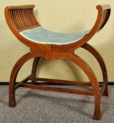 An Edwardian mahogany and inlay window seat/ dressing stool having a bowed seat