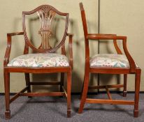 A pair of George III style mahogany shield back elbow chairs/carvers. Measures; 97cm tall.