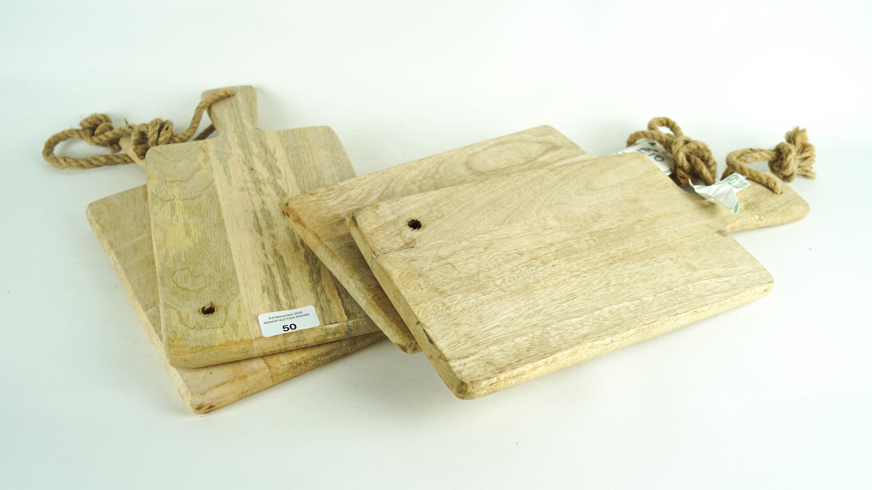 Four wooden chopping boards