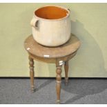 An oak table and a terracotta pot