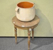 An oak table and a terracotta pot