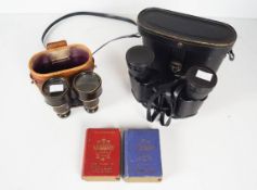 A pair of binoculars and card games
