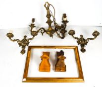 A brass light and some picture frames
