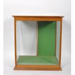 An oak glazed display cabinet