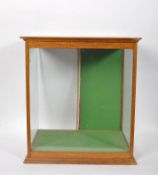 An oak glazed display cabinet