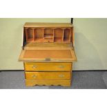 A pale oak bureau,