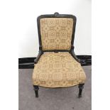 A Victorian ebonised nursing chair