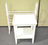 A two tier white painted table together with a painted clothes horse