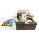 A box of tea and cigarette cards