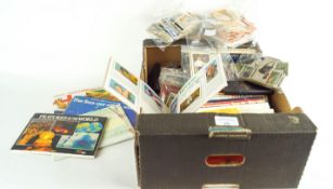 A box of tea and cigarette cards