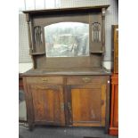 An Arts and Crafts oak sideboard