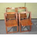 Four teak garden chairs