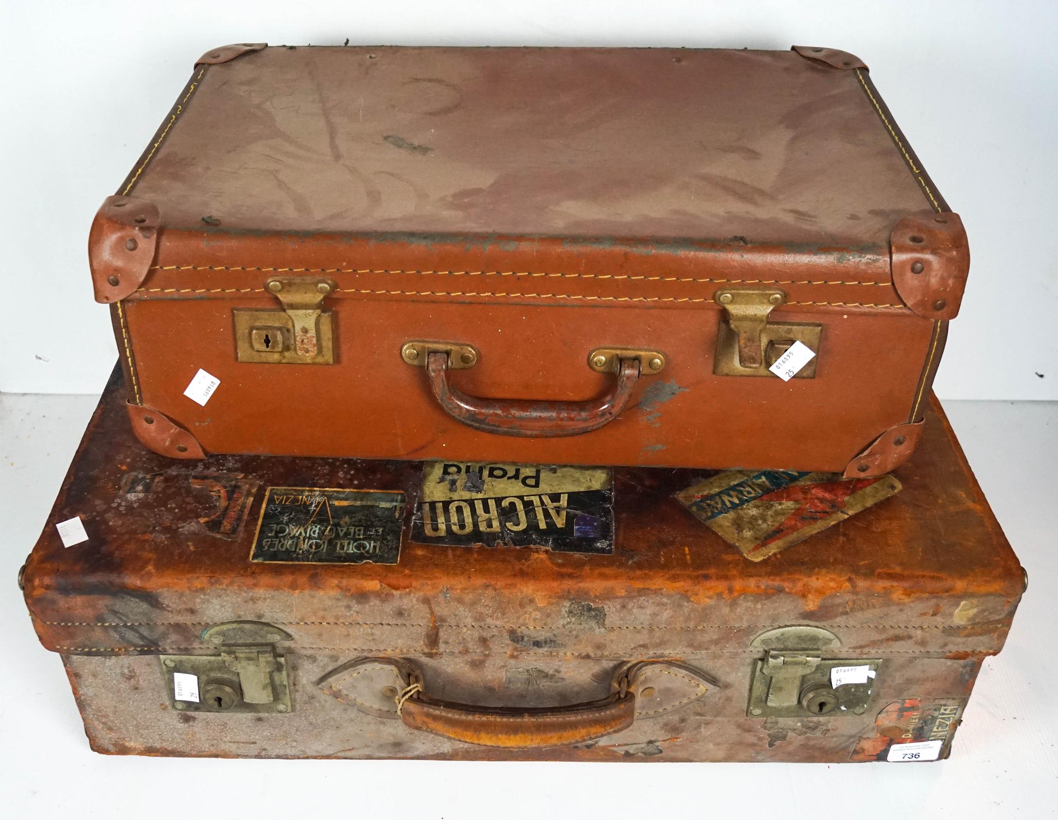 A leather suitcase and another