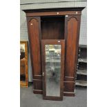 A mahogany wardrobe with single door