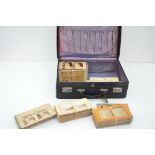 A large collection of 215 stereoscope slides in a vintage suitcase