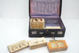 A large collection of 215 stereoscope slides in a vintage suitcase