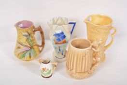 A Sylvac jug, a majolica jug, a Burleighware jug and others